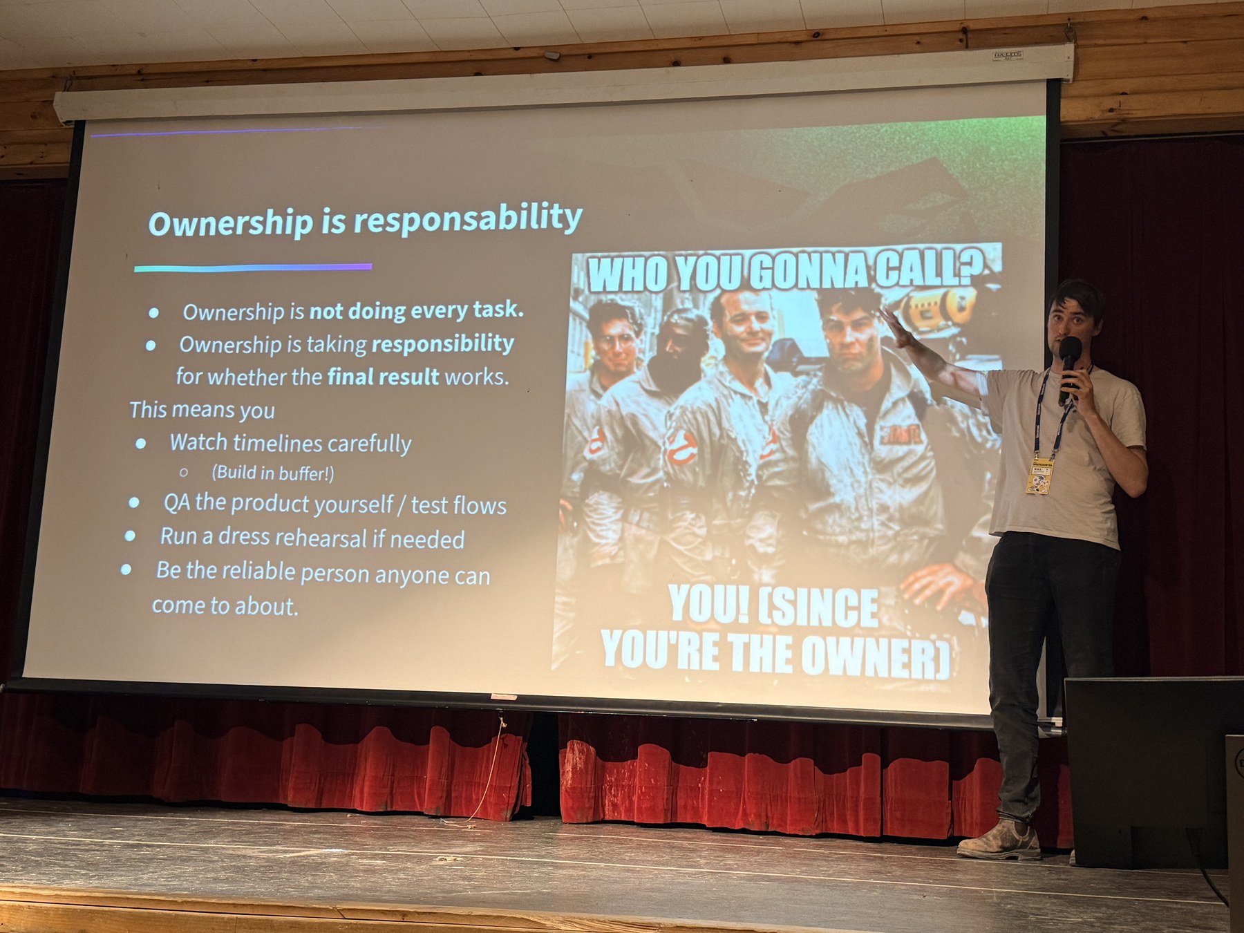 Alex Aumais presenting a slide about project ownership at Hackcon 2026
